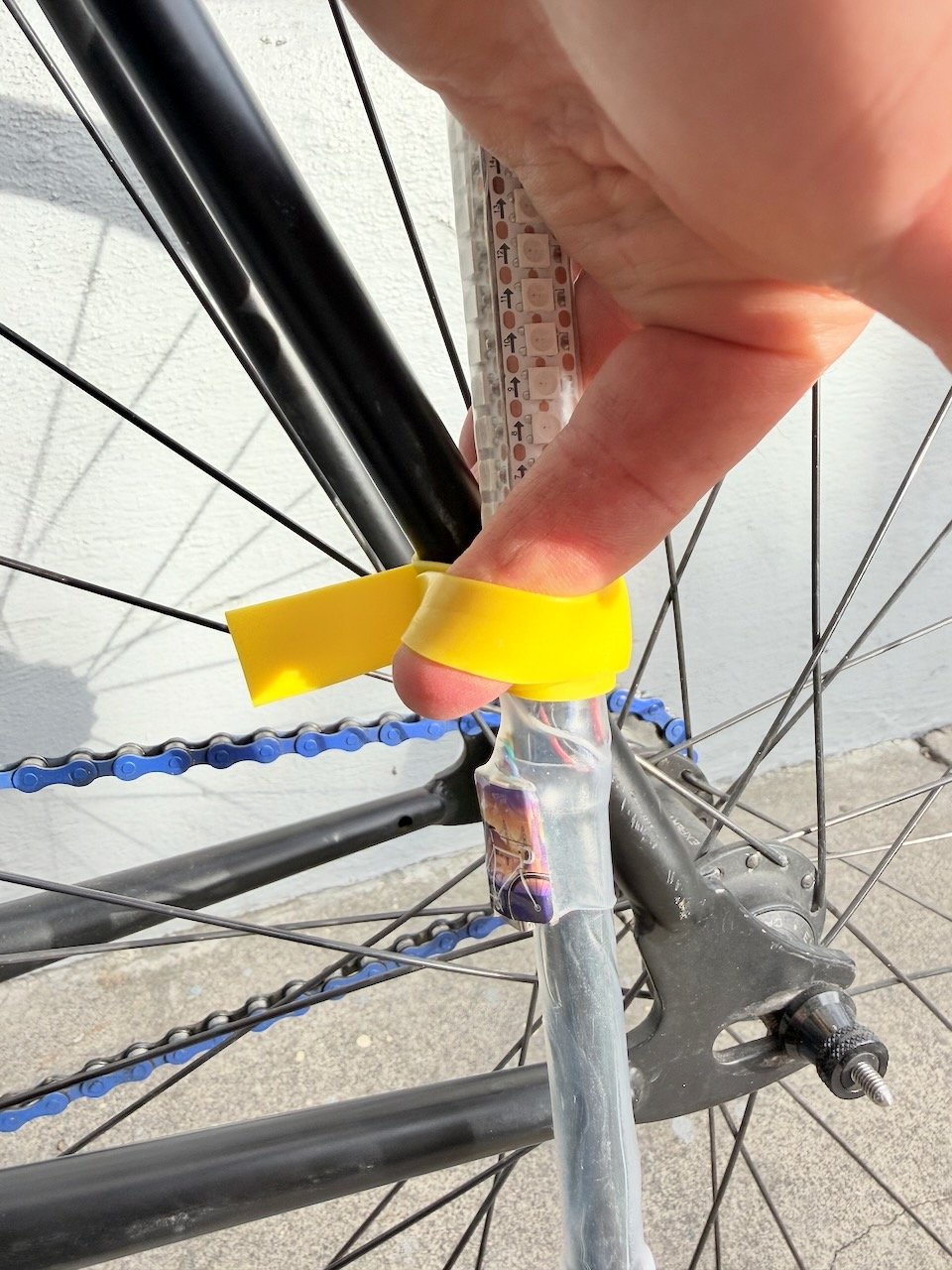 Placing finger under strap