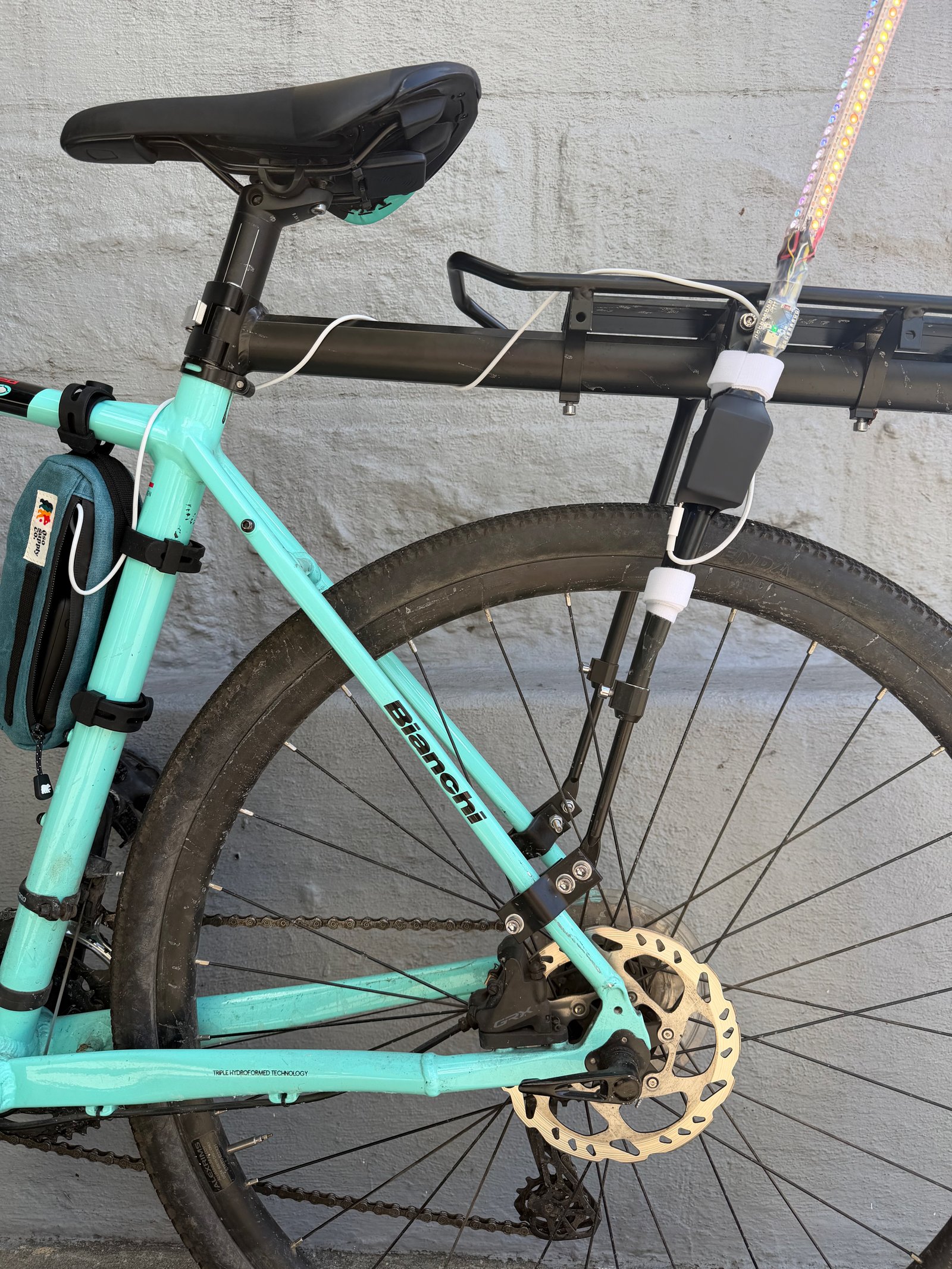 Pole mounted to bike rack