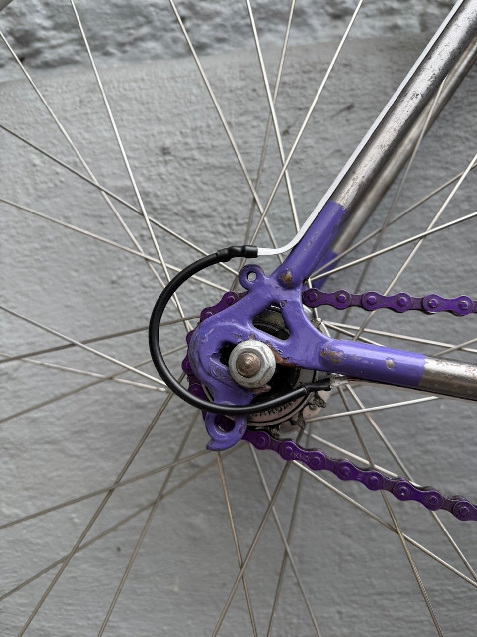 Continuing along frame tube