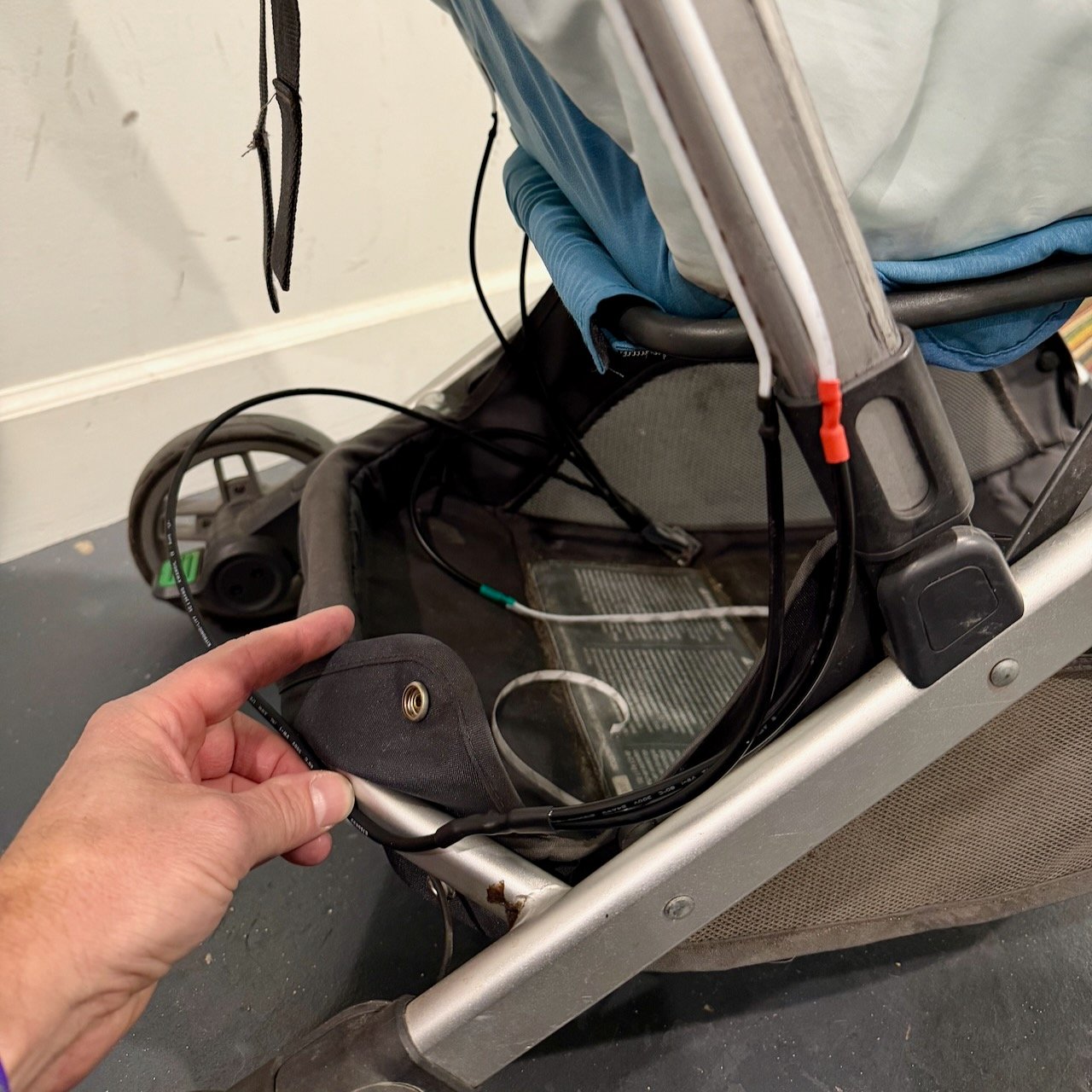 Routing wire across stroller - view 1